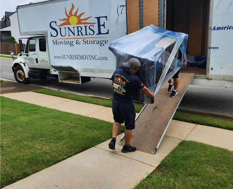 sunrise moving & storage crews load furniture into a truck