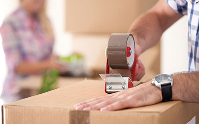 Packer packing a box